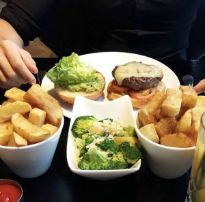 Burger and chips with brocolli