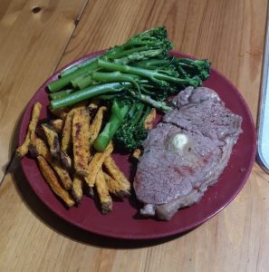 Steak with sweet potato fries and brocolli